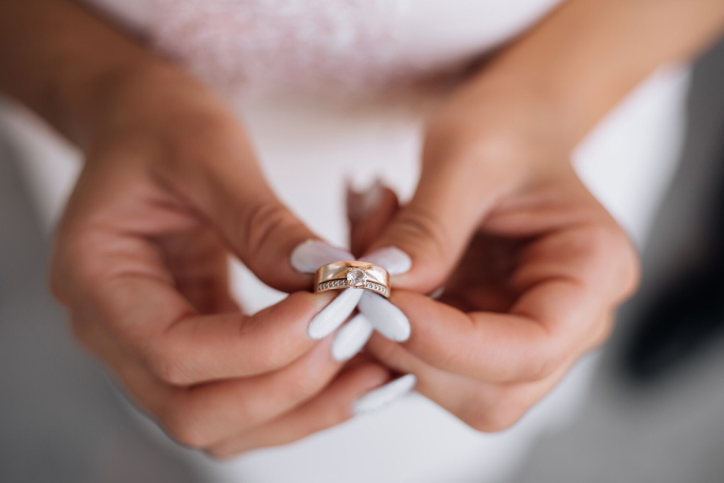 woman-holds-precious-wedding-ring-her-arms_8353-8129.jpg